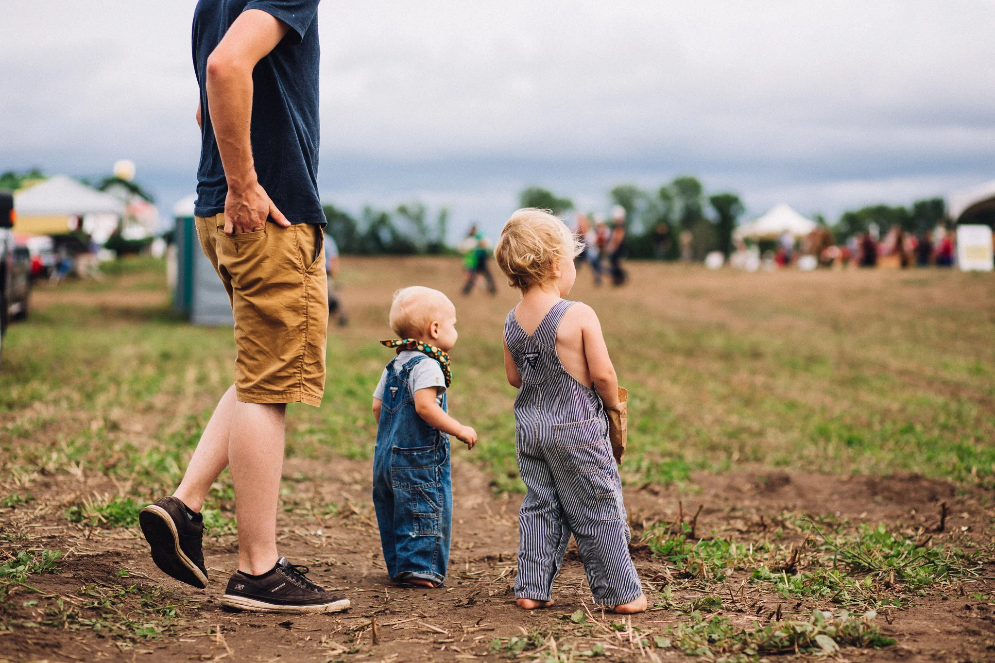 boys with dad in field
