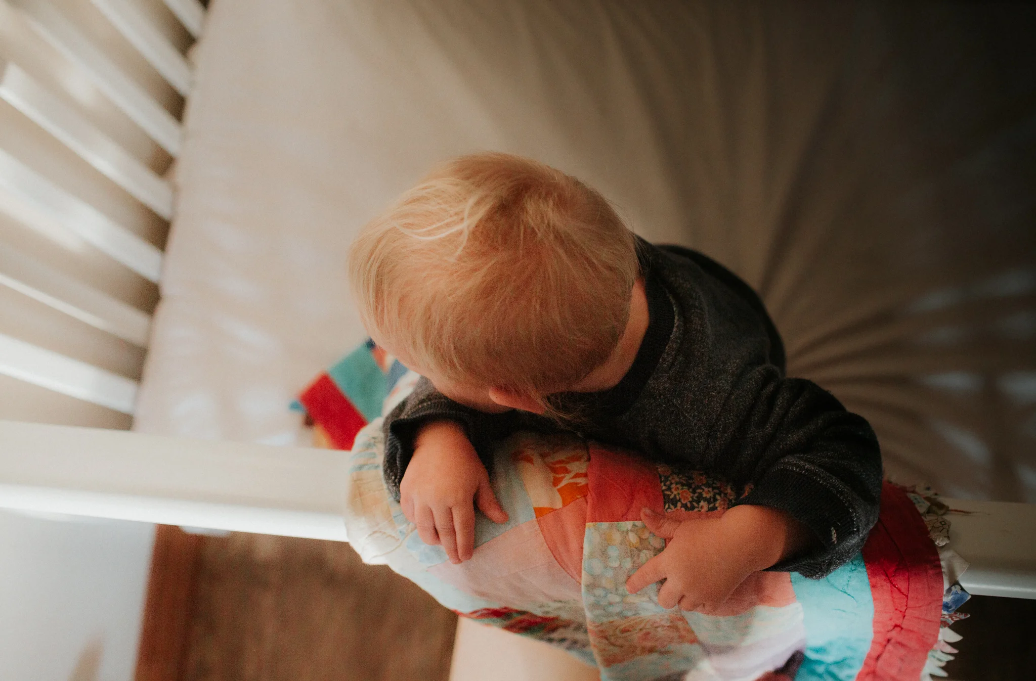 toddler in crib