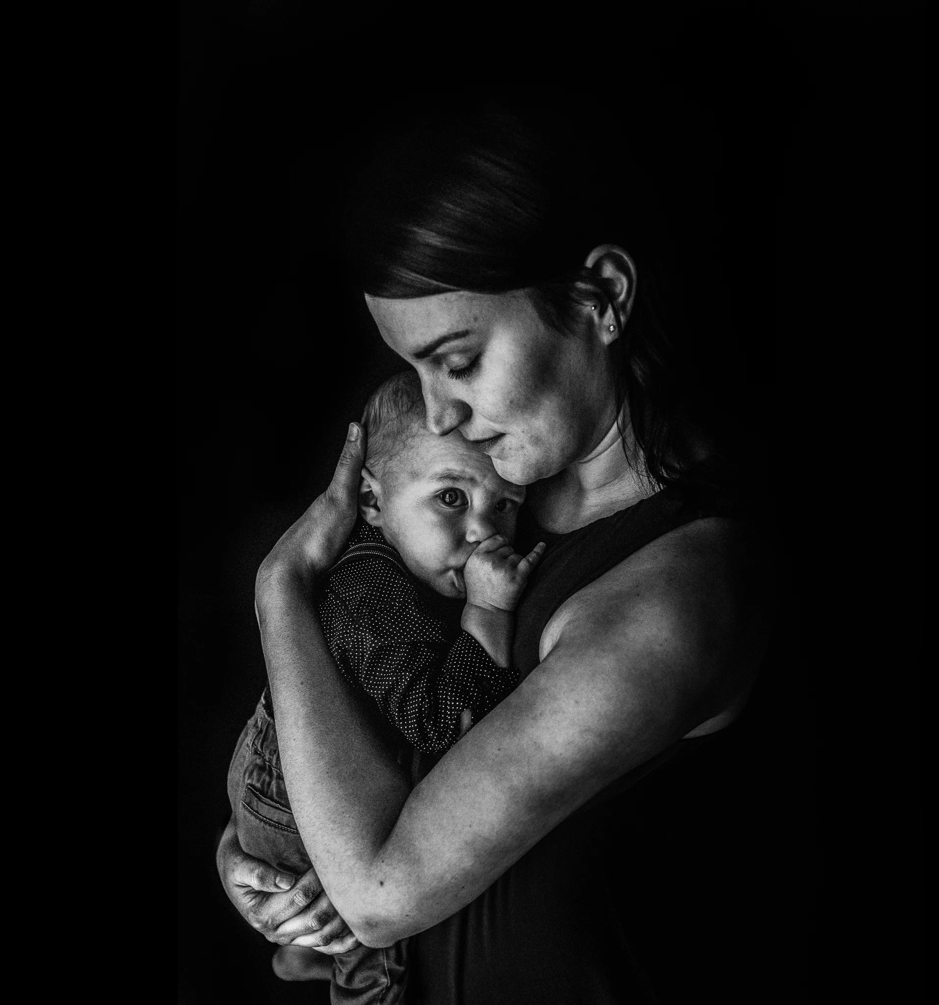 mom snuggling baby