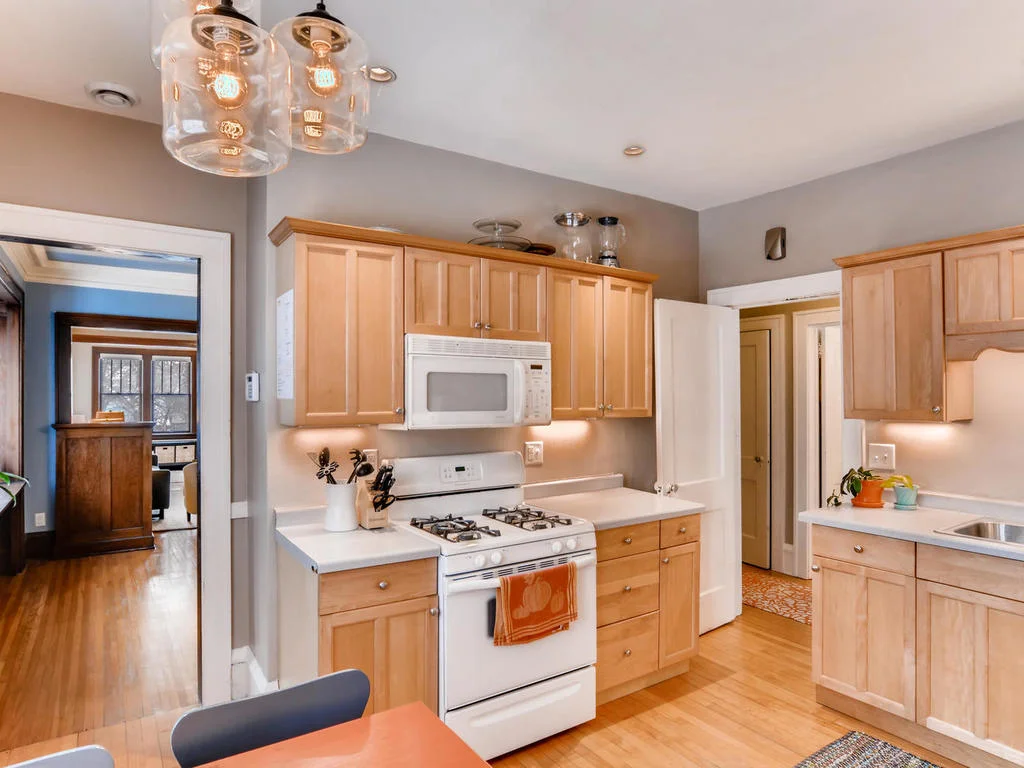 The kitchen is really good sized for a duplex - it’s one of the reasons we fell in love with the building. The previous owner had installed the newer cabinetry. We put in a new range and microwave.
