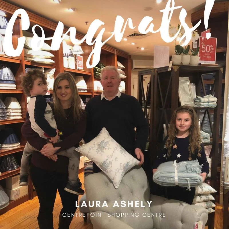 Out happy winner of the Laura Ashley Hobart scatter cushion and throw rug has collected her prize. Willo Mia McClay, along with Charlie and Bonnie are pictured with Centre Manager Brett McGrath. Well done Willo.