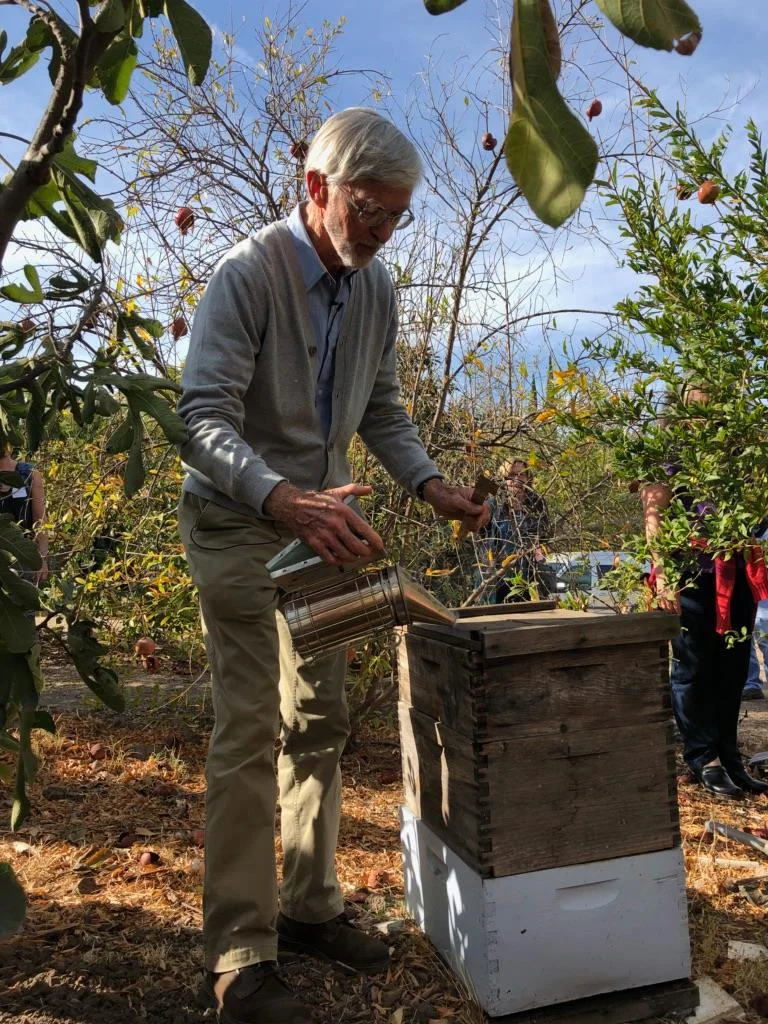 Our friend, Gunthur Hauk, getting to know our bees.