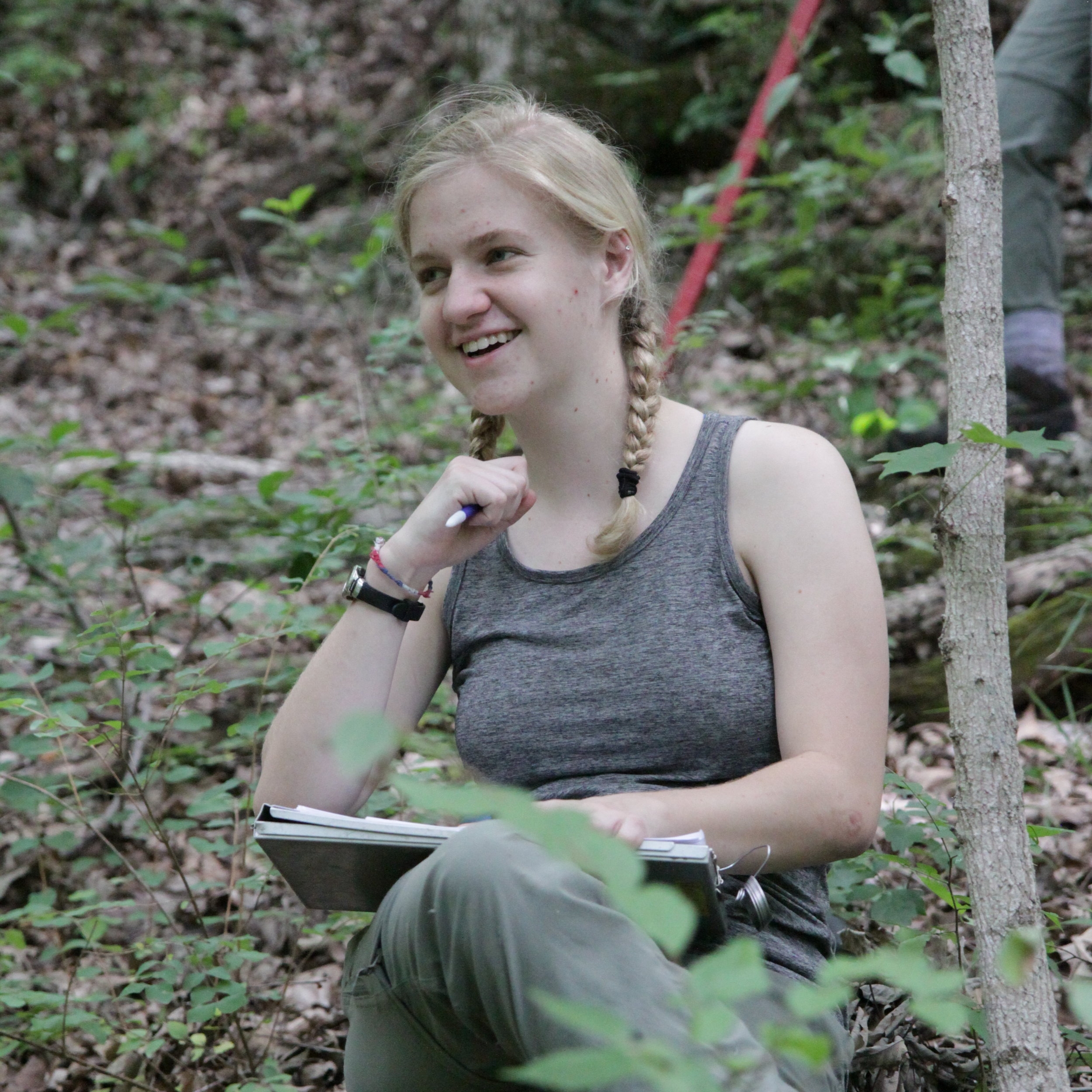 Emma enjoying data entry in the forest