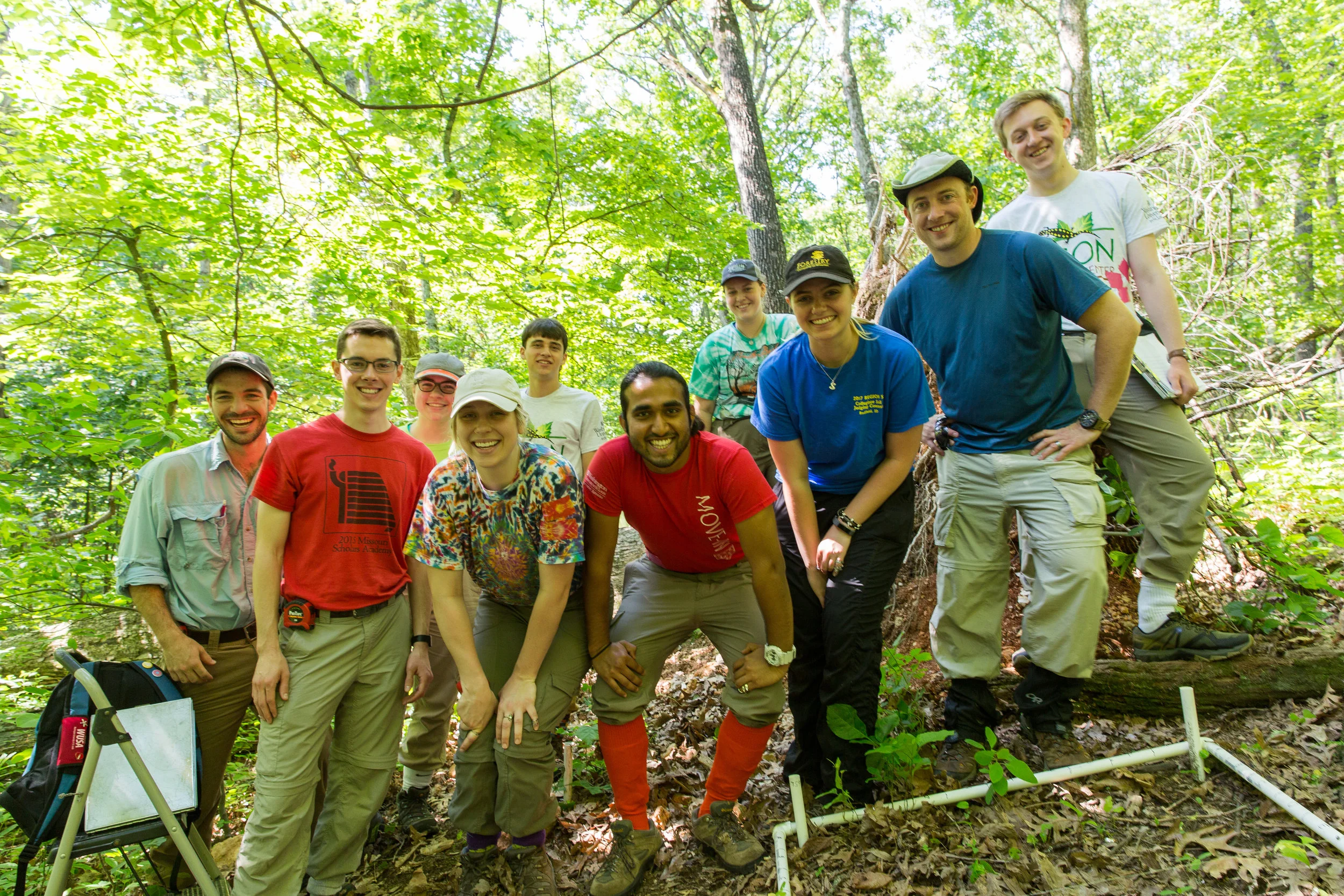 Forest researchers in their natural habitat! The Forest Biodiversity Team taking Brian Sedio on a tour of their Tyson field sites. (Photo: Jonathan Myers) (l to r) Ben Chase, Eli Mennerick, Kristen Riedinger, Melanie Grasso, Jacob Amme, Saransh Gothi, Arden Brewer, Sera Holland, Brian Sedio, Paul Elliott