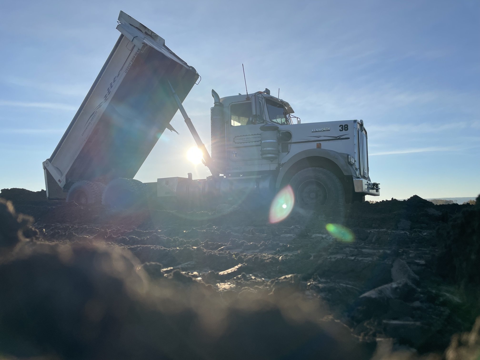 Columbia Groundwork dump truck delivering a load