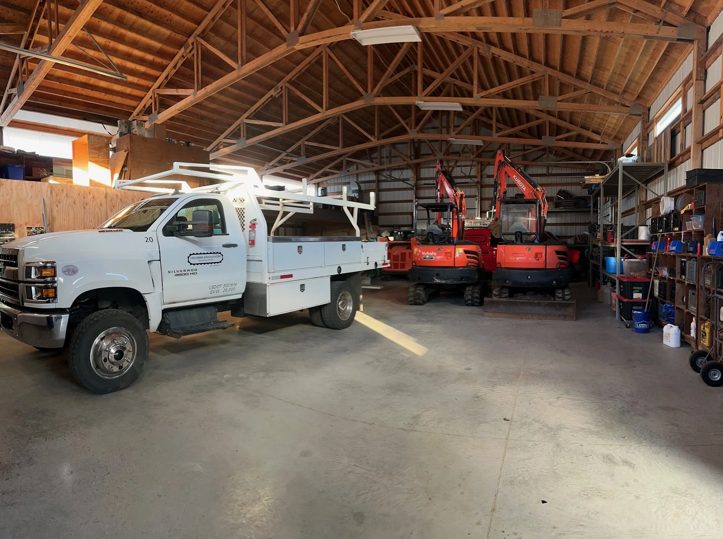 Columbia Groundwork service truck and mini excavators in our shop