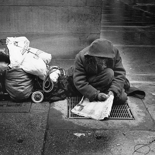 Apparently_homeless_man_doing_crossword.jpg
