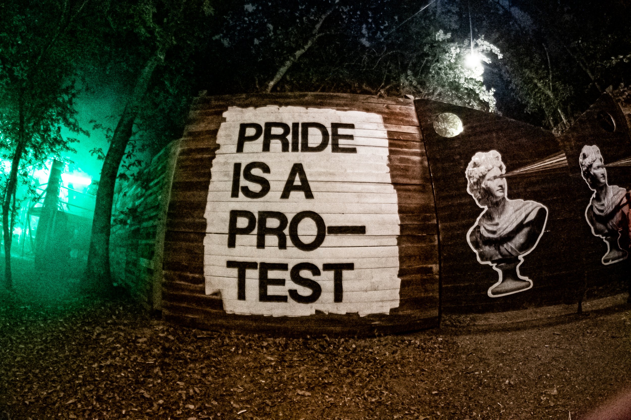 Mother After Dark wall with artwork saying Pride is a Protest