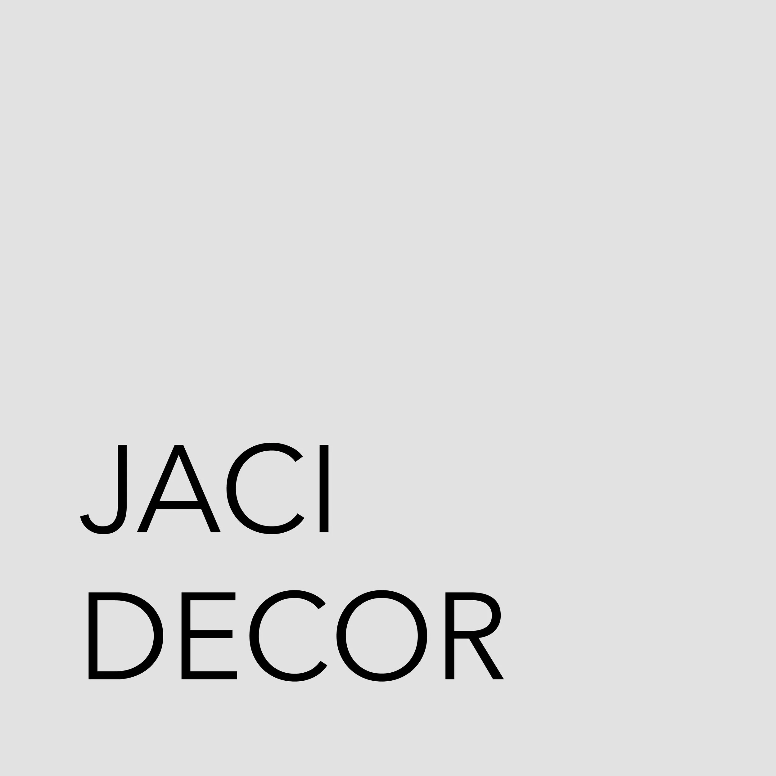 Close-up of a white wall sign with black text that reads 'JACK DECOR'.