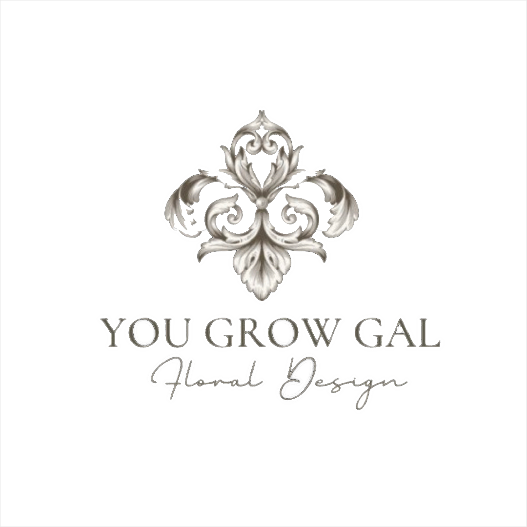 Logo for You Grow Gal Floral Design featuring a silver ornamental floral emblem with the text 'YOU GROW GAL' and 'Floral Design' beneath it.