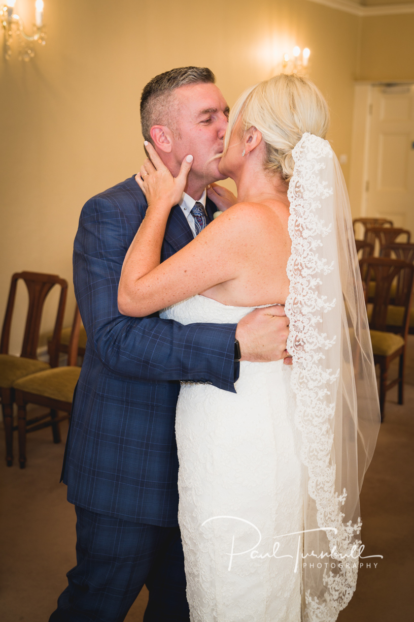 Bride and groom First Kiss at Harrogate Register Office. Wedding Photographer Yorkshire