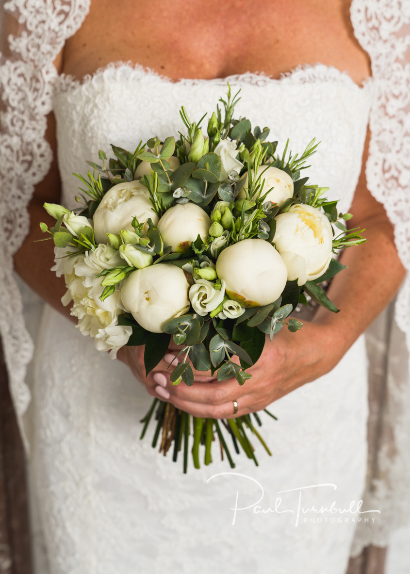 Bride Posing with Flowers at Harrogate Register Office. Wedding Photographer Yorkshire