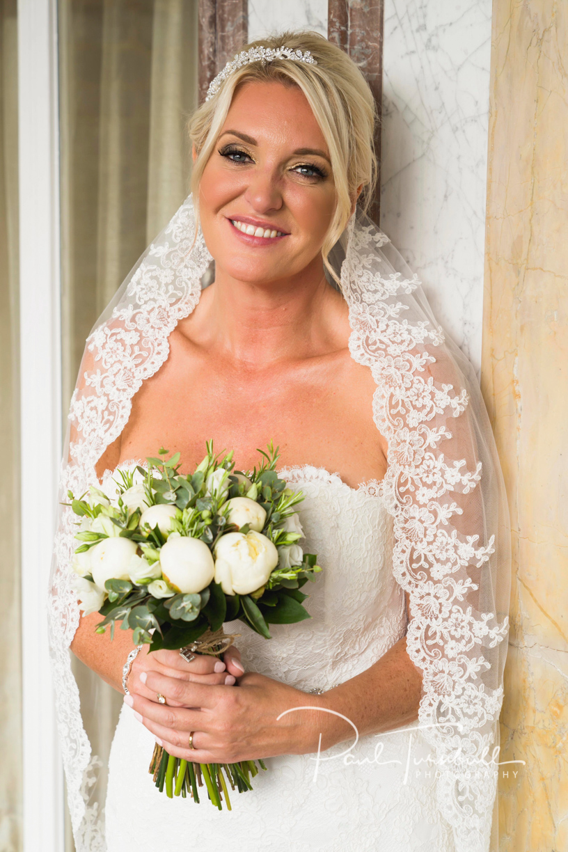Bride Posing with Flowers at Harrogate Register Office. Wedding Photographer Yorkshire