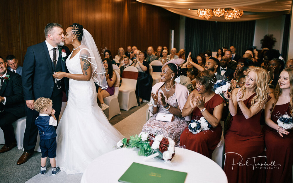 The first kiss at their Lazaat Hotel wedding. Wedding photographer Hull