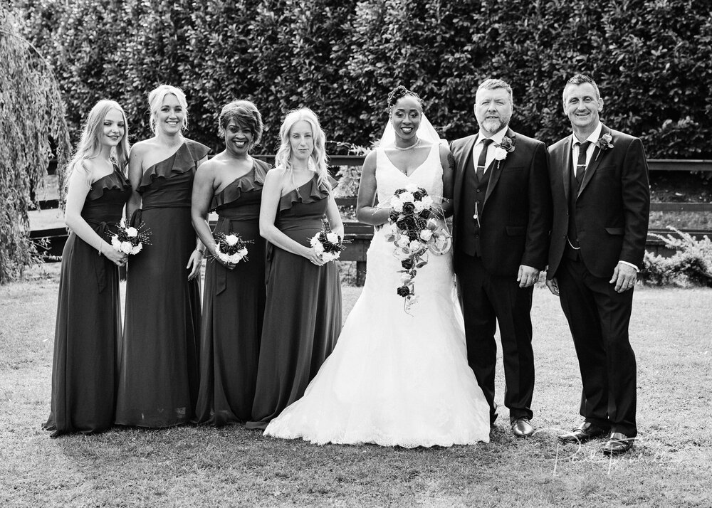 Bride, groom, bridesmaids and best man posing outside Lazaat. Wedding photographer Hull