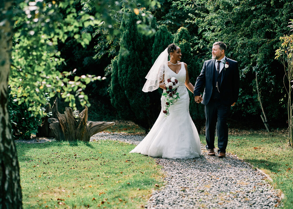 Bride and groom enjoying the gardens of Lazaat Hotel. Wedding photographer Hull