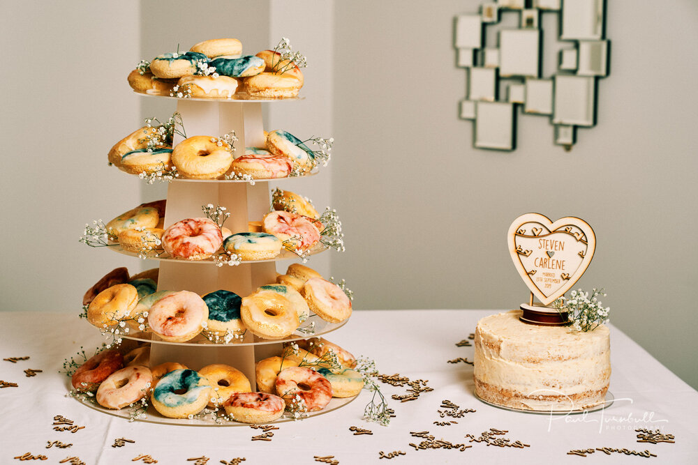 Doughnut tower and wedding cake at Lazaat Hotel. Bride and groom enjoying the gardens of Lazaat Hotel. Wedding photographer Hull