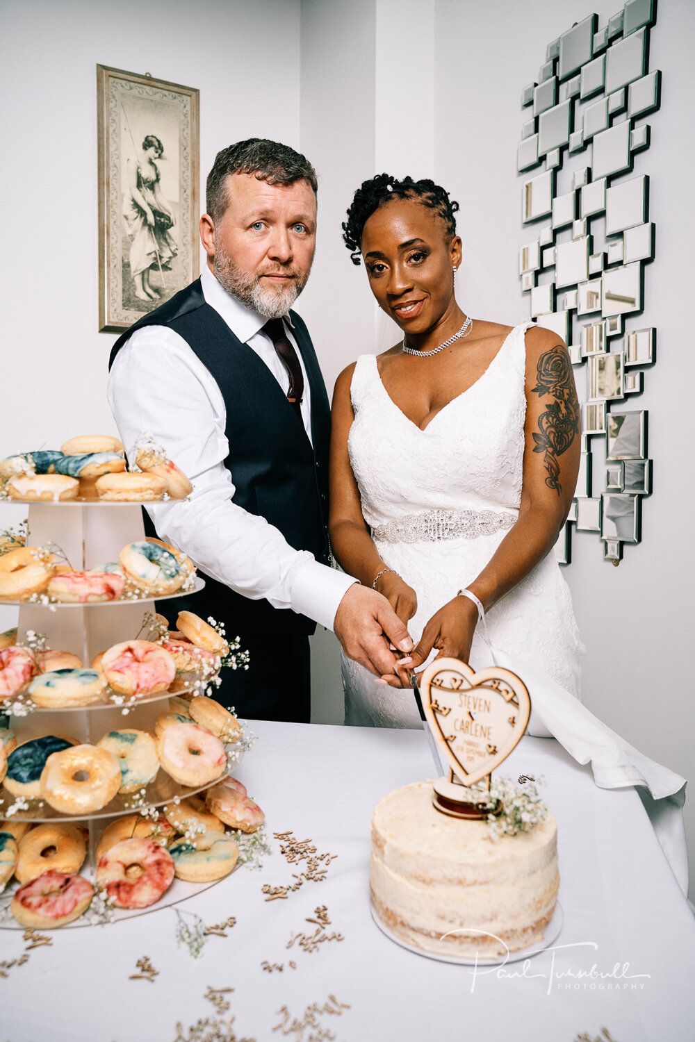 Cutting the wedding cake at Lazaat Hotel. Bride and groom enjoying the gardens of Lazaat Hotel. Wedding photographer Hull