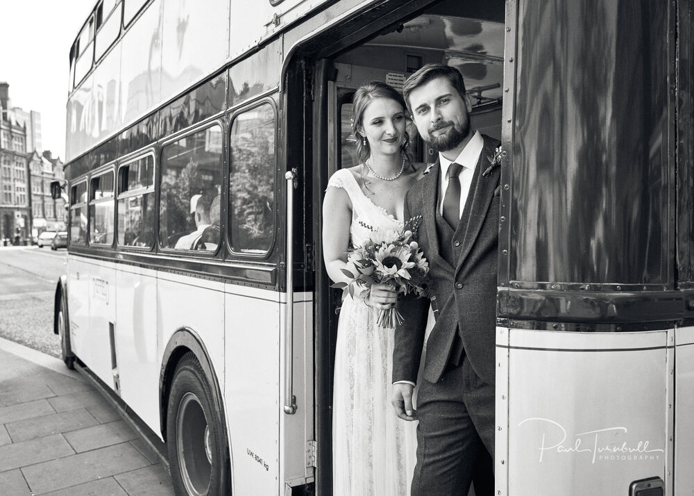 Newlyweds Pose with Vintage Bus. Wedding Photography at Sheffield Town Hall