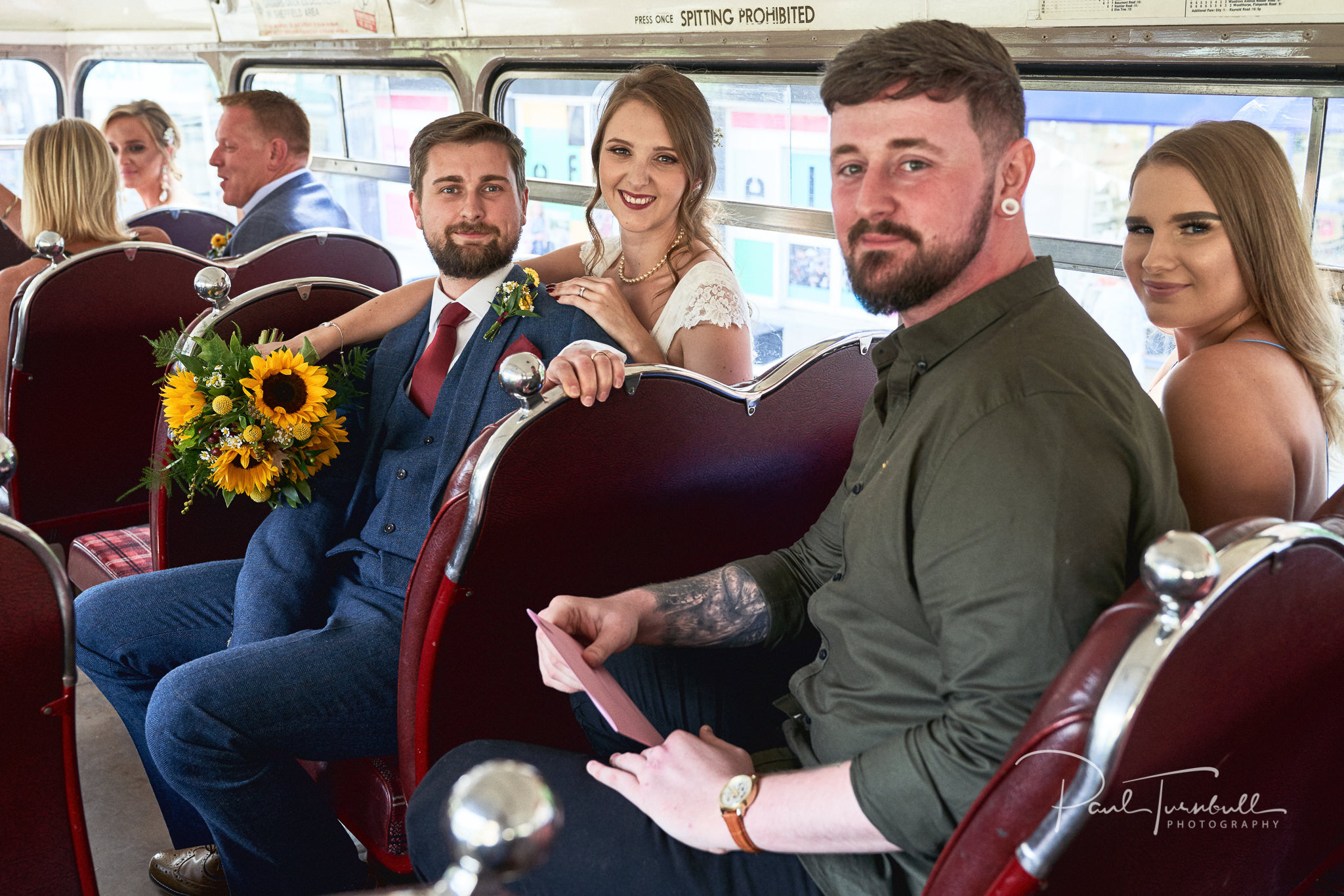 Newlyweds on Vintage Bus. Wedding Photography at Sheffield Town Hall