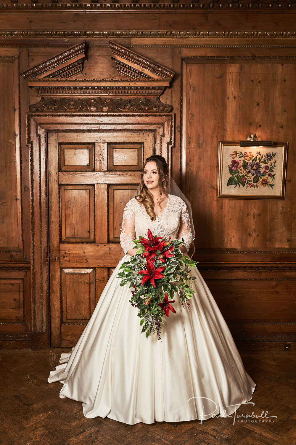 Bride in her wedding dress holding bouquet