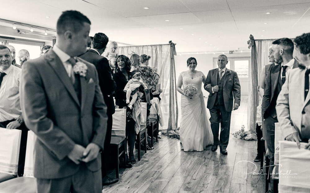 Wedding Photographer The Fleece, Bride Walking Aisle with Father