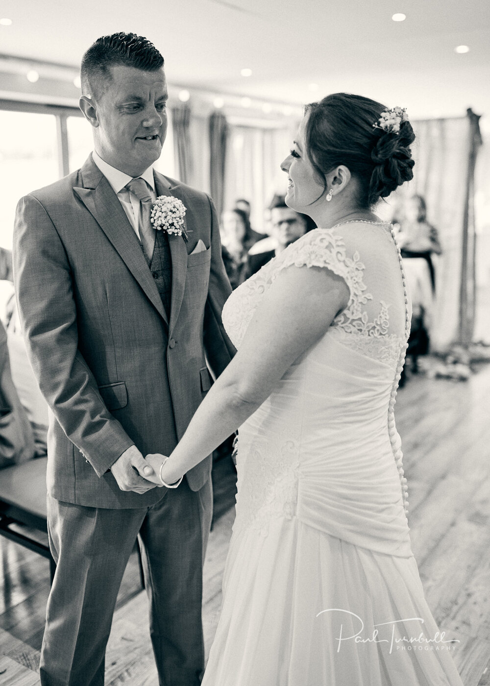 Wedding Photographer The Fleece, Bride and Groom Looking at Each Other during Ceremony