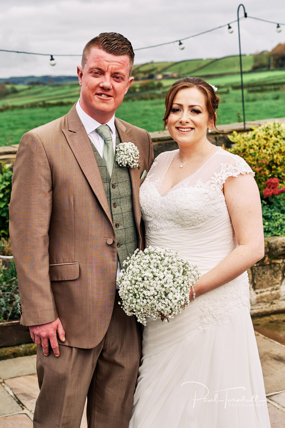 Wedding Photographer The Fleece, Bride and Groom Pose Outside The Fleece