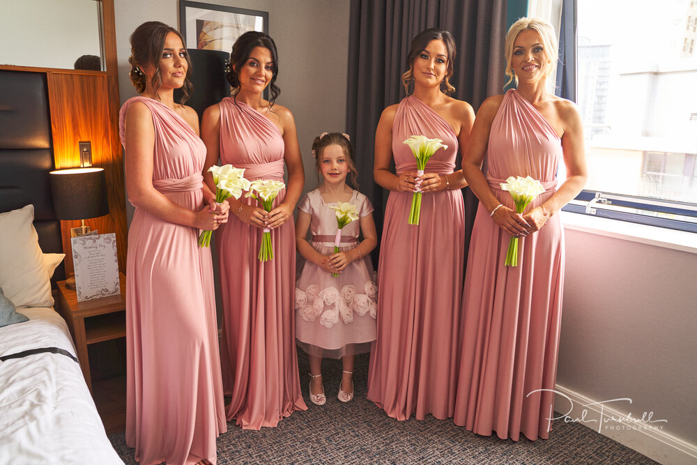 Bridesmaids and Flower Girl Holding Wedding Flowers