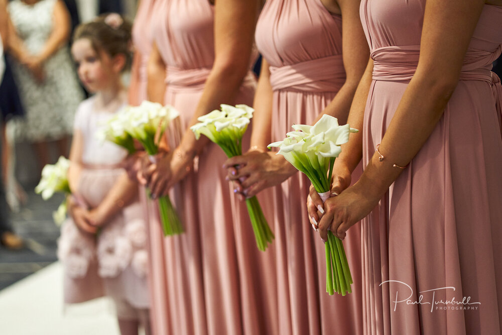 Flower Girl and Bridesmaids Holding Flowers