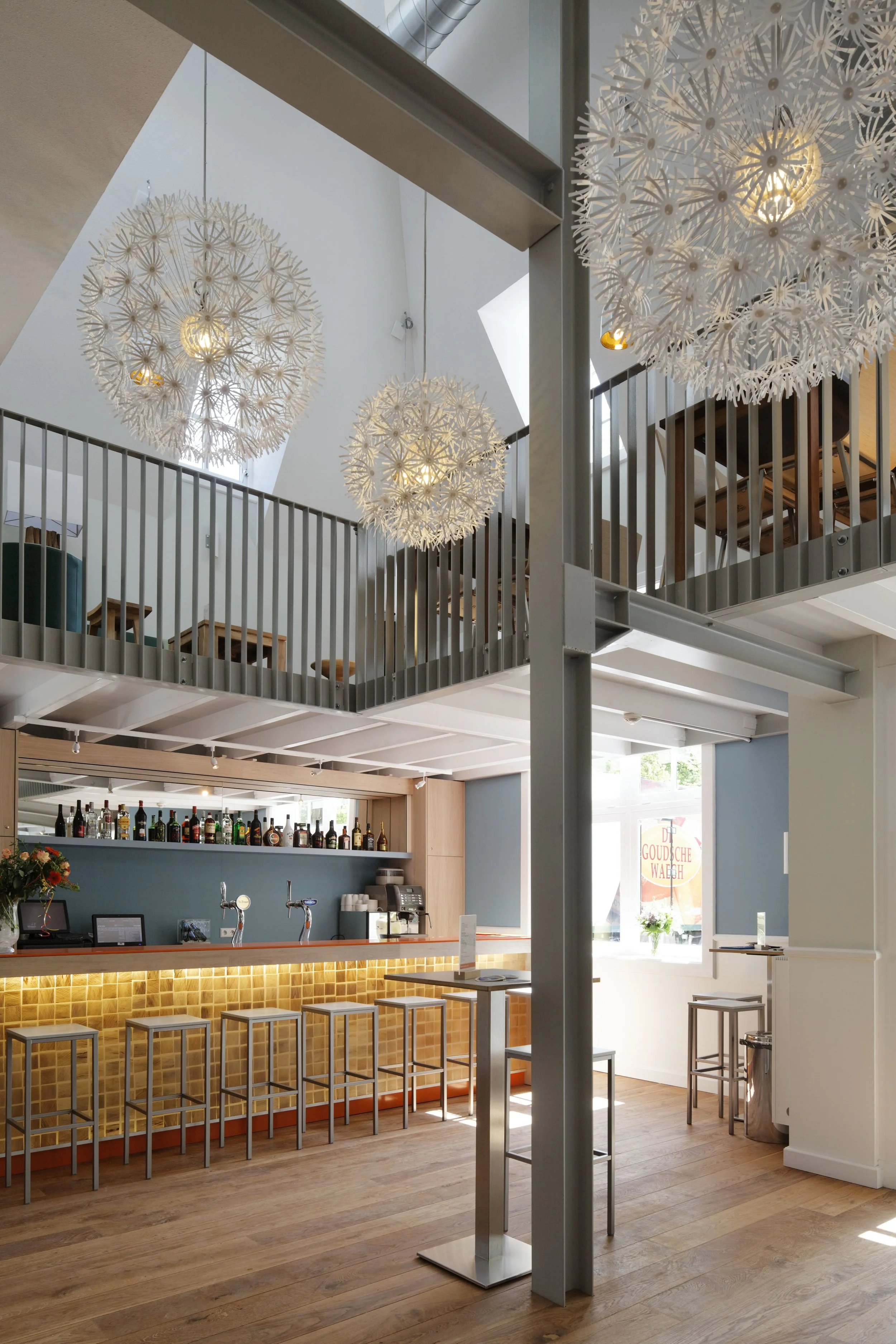 interior of main entrance building with bar and mezzanine