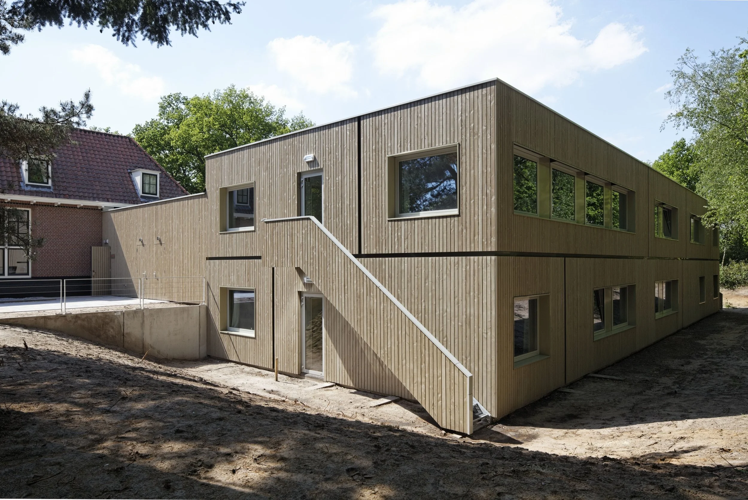 renovated Douglas Fir-clad guestrooms looking onto the surrounding forest