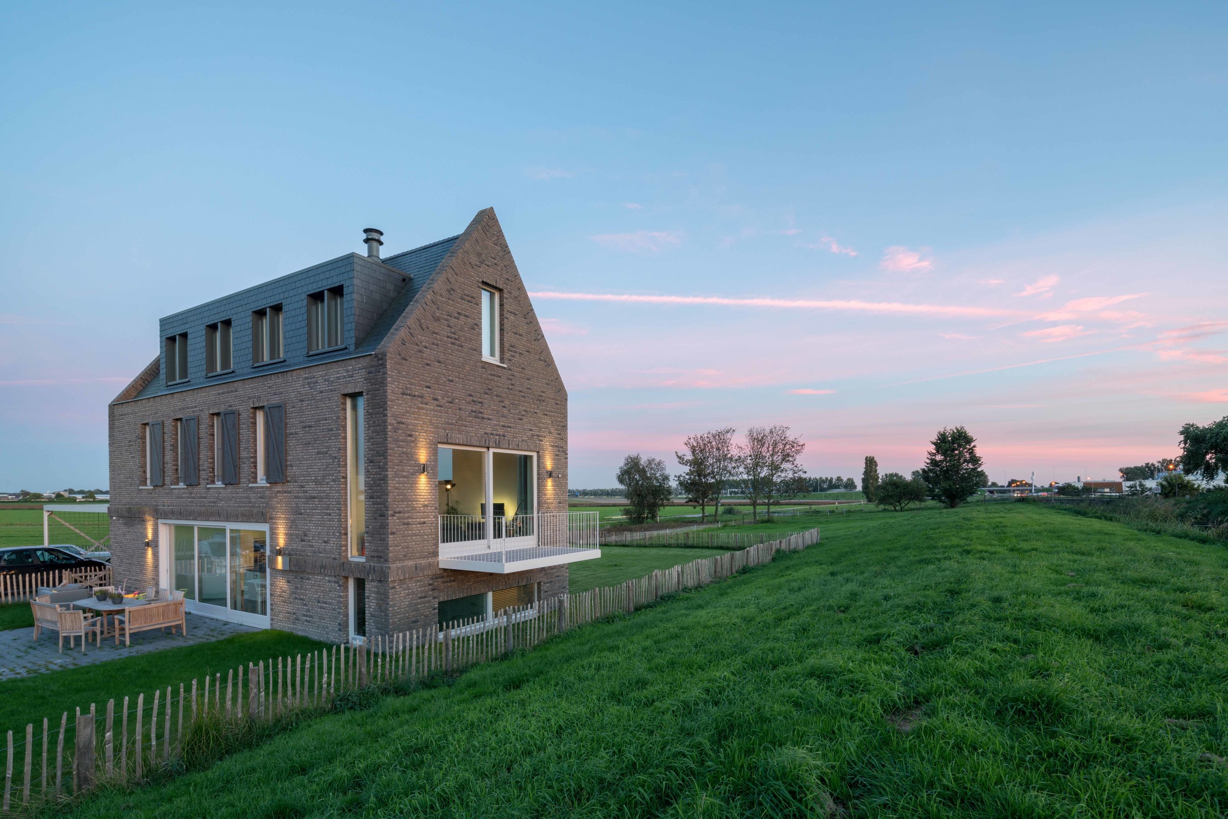   "not a box in an empty field”   contemporary variation on the classic Dutch dike house 