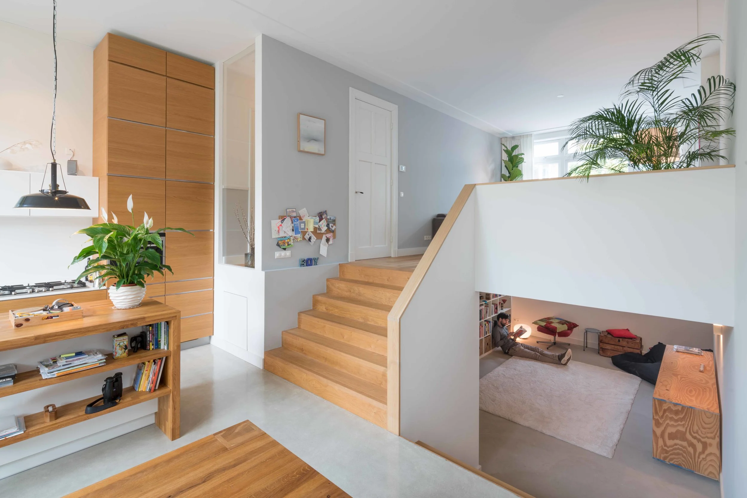 split level with wide stairs connecting living, kitchen and dining area with the basement