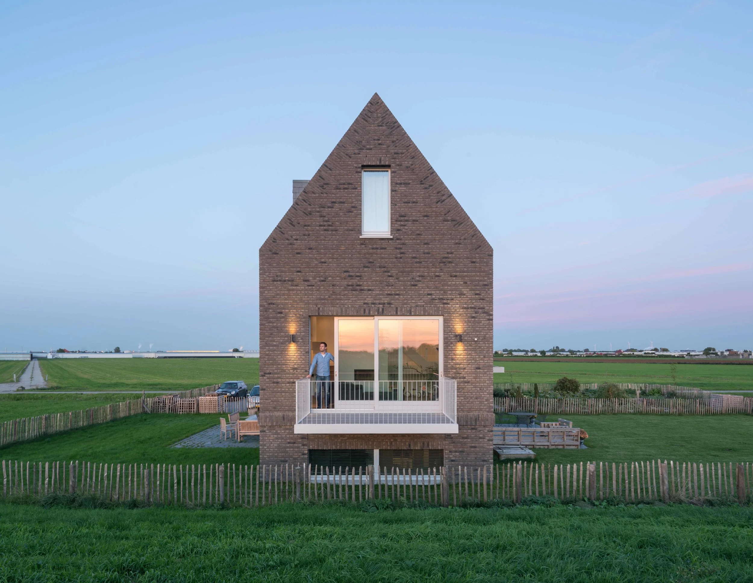 at first glance it is a traditional dike house, a second look will reveal its contemporary and mysterious characteristics