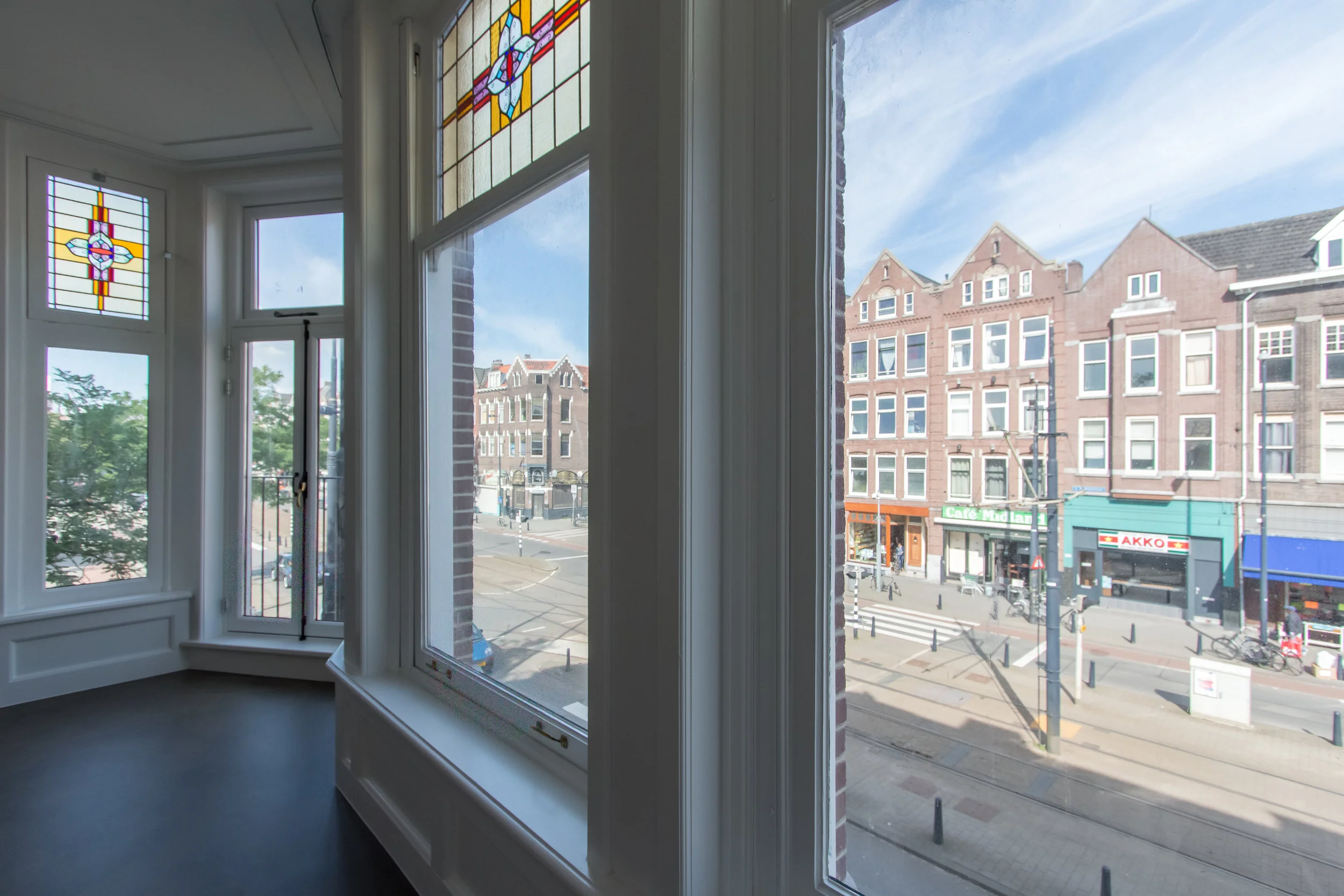 the original windows are maintained but fitted with double glass. Original stained glass inserts were salvaged where possible.