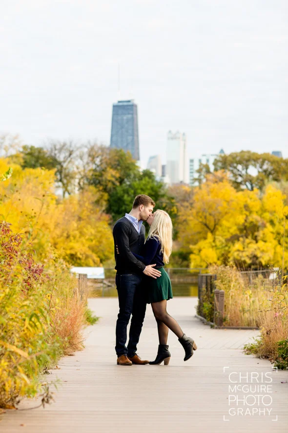 couple kissing with fall colors and hancock building