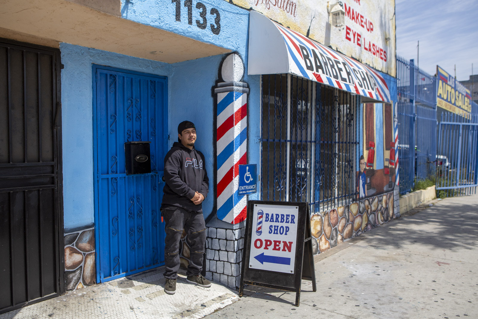 Daniel Sanchez owner of Giann’s barbershop in the predominantly Latinx community of Florence, where very few businesses got PPP loans for Reveal