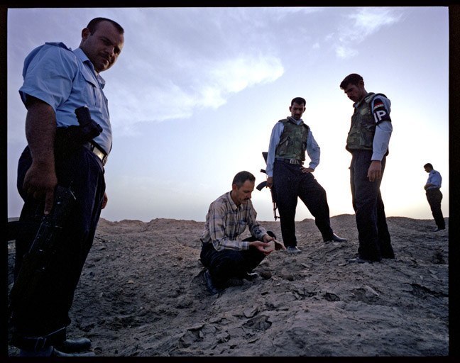  Abdul Amir Hamdani with Iraqi police inspecting looted archaeological site. May, 2004.&nbsp;   