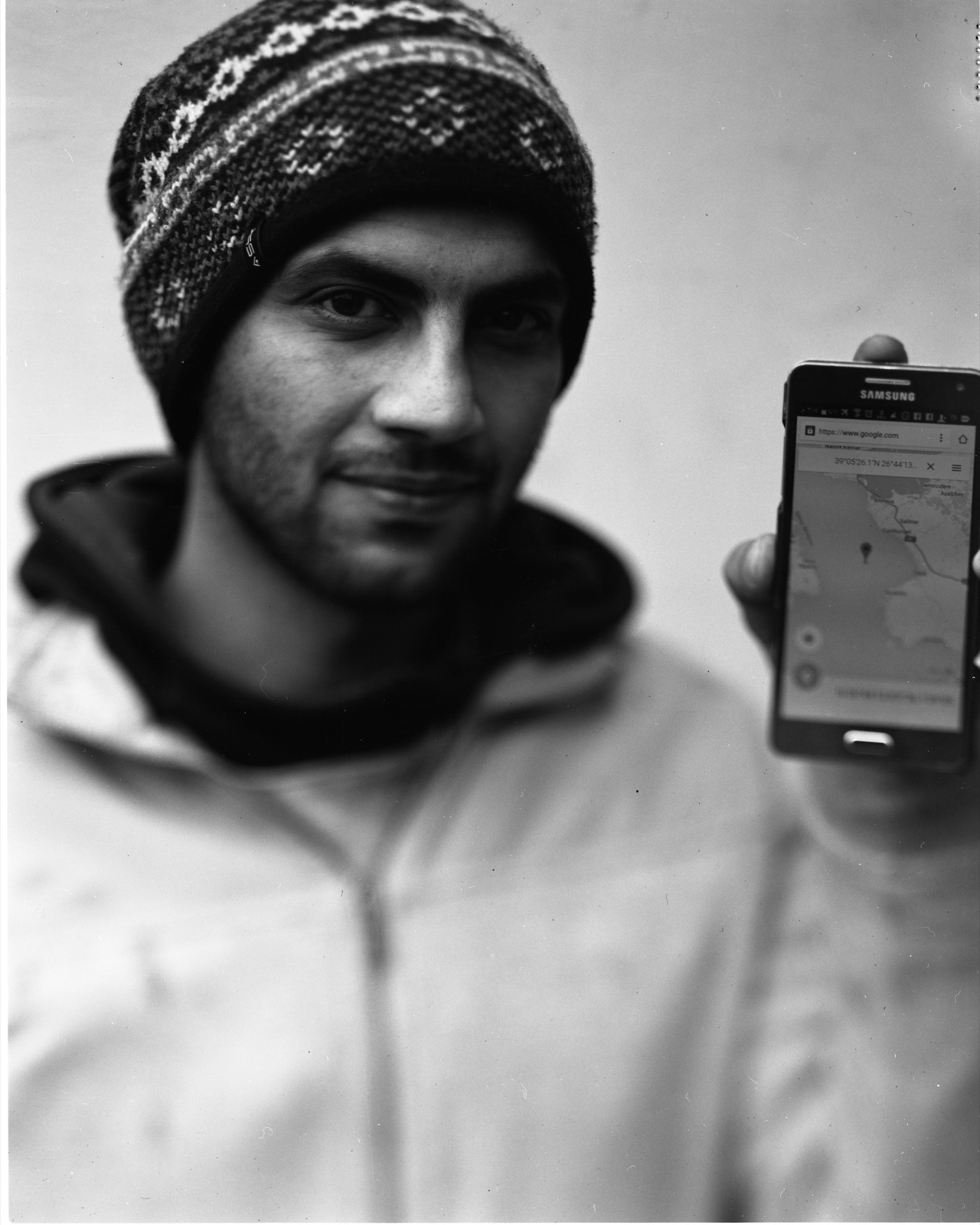  Hazem Ayoub from Homs, Syria, with his WhatsApp account and a pin showing where he was during his crossing of the Aegean Sea from Turkey to the island of Lesbos.   