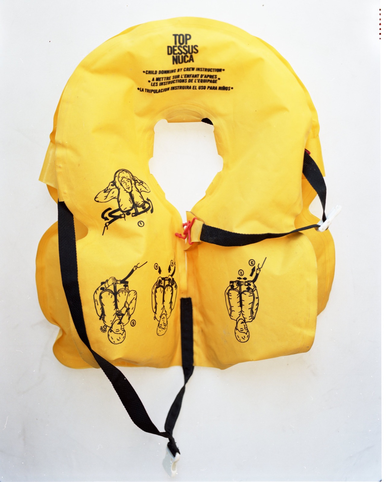  A life vest worn during a crossing of the Aegean Sea from Turkey to Greece, left behind on a beach in Lesbos.   