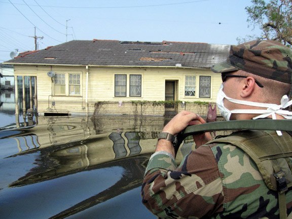  National Guard patrol flooded neighborhood in New Orleans. The National Guard wore face masks to protect against the stench from the fetid, toxic water.&nbsp;   