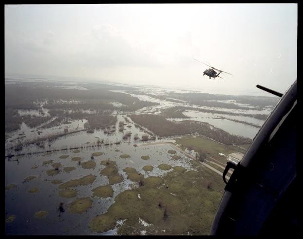  Helicopters with 82nd Airborne fly over flooded area in Cameron Parish Louisiana surveying the damage, September 27, 2005.   