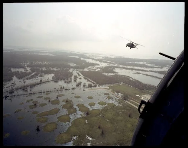 Helicopters with 82nd Airborne fly over flooded area in Cameron Parish Louisiana surveying the damage, September 27, 2005.