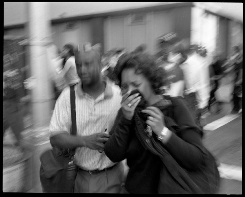  Woman is led away from the collapse of the World Trade Center towers in lower Manhattan, September 11, 2001.&nbsp;   