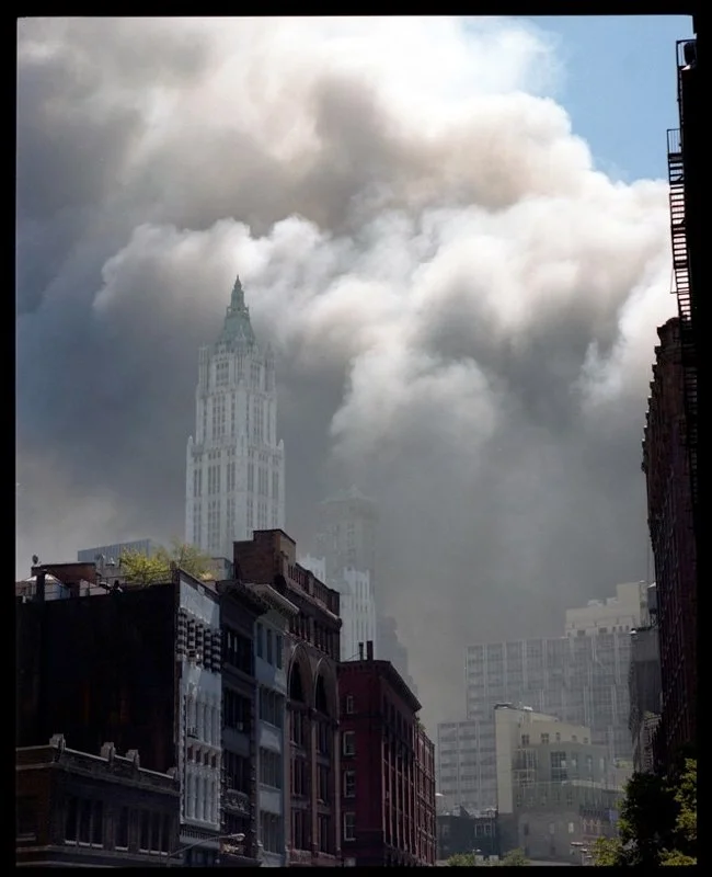Cloud of dust over the Woolworth building in lower Manhattan after the collapse of the two World Trade Center buildings, September 11, 2001. 