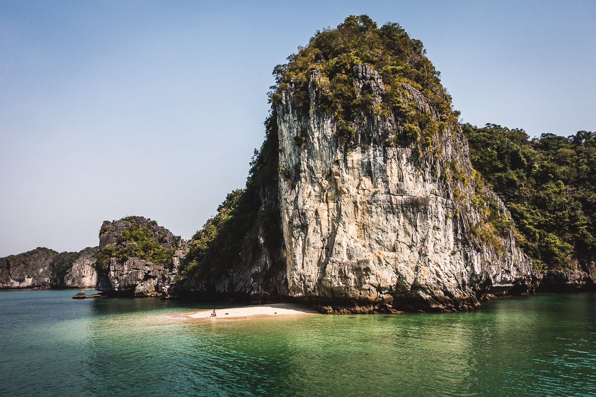 Me, chilling on a small white-sand beach, far from the hussle of Halong Bay.