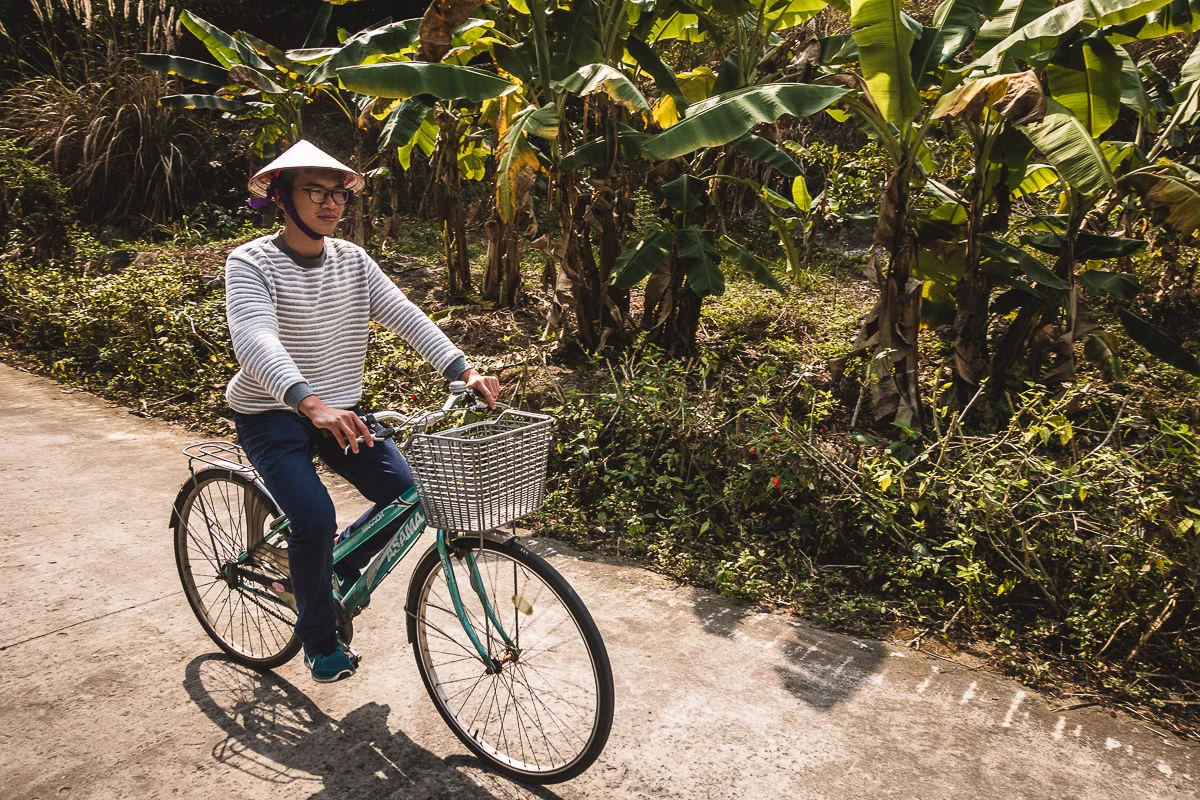 Our guide Koo riding the bike on Cat Ba Island.