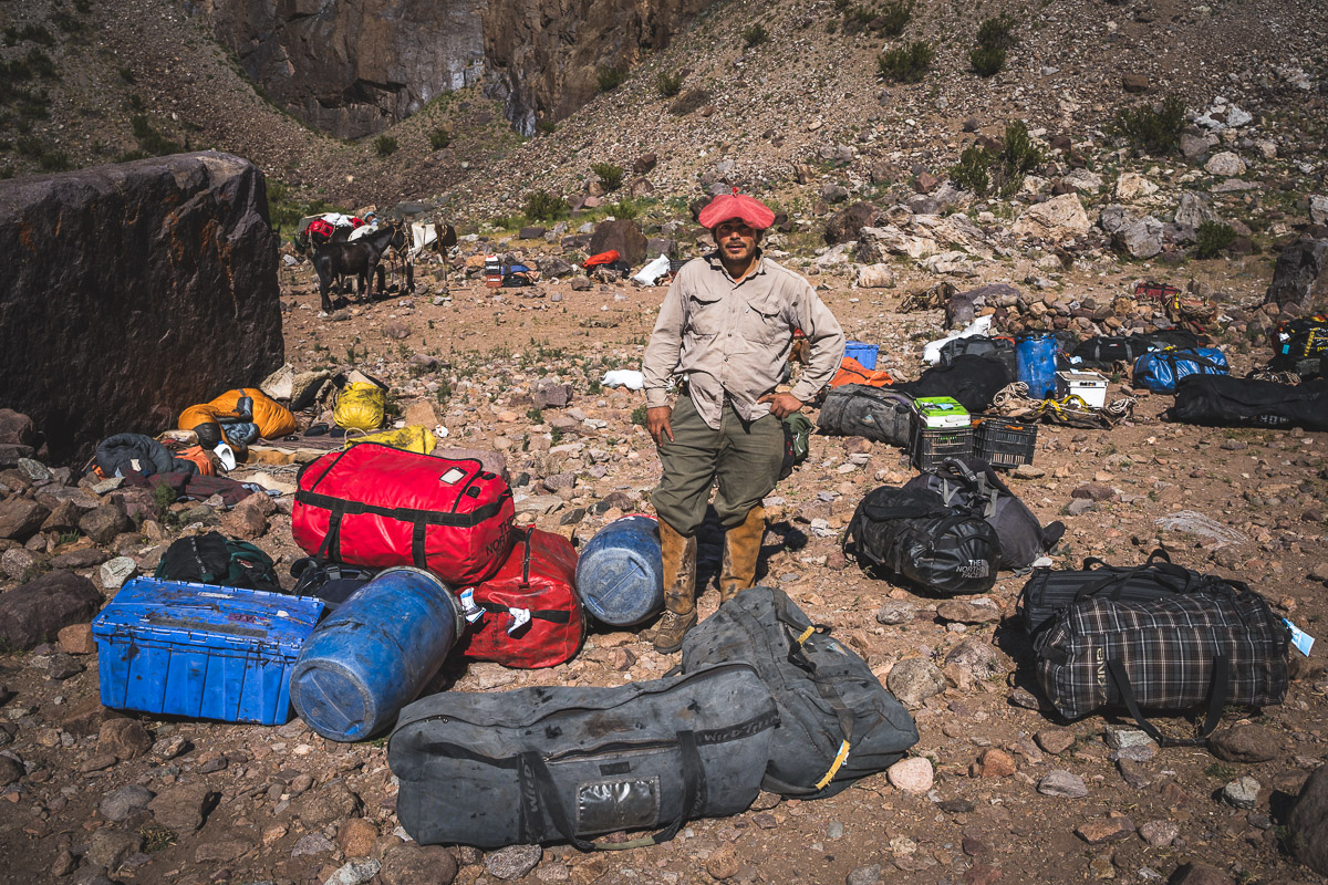 One of the arrieros unloading our luggage from the mules