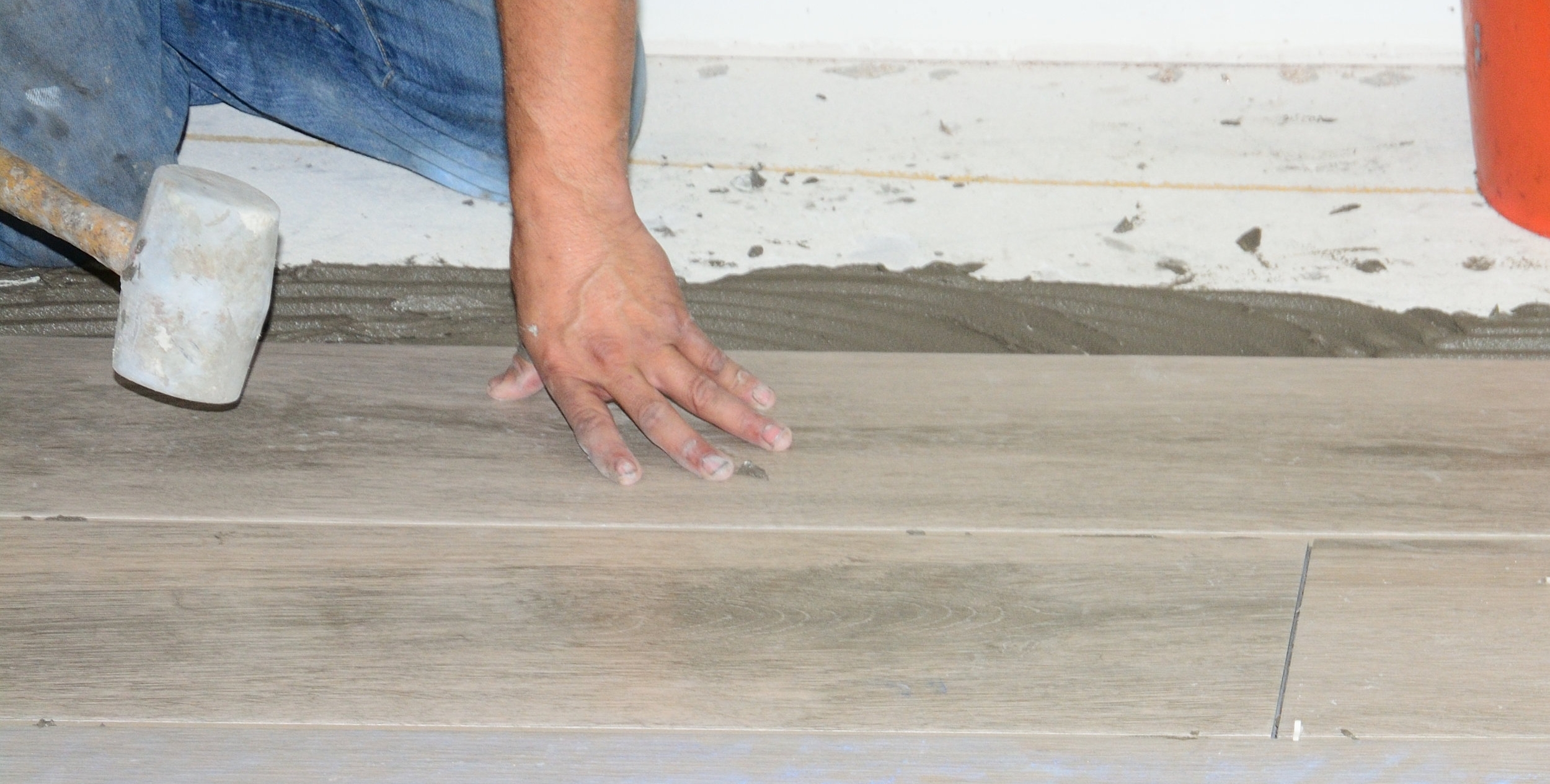 Installing-new-tile-floor-686689814_2617x1745.jpeg